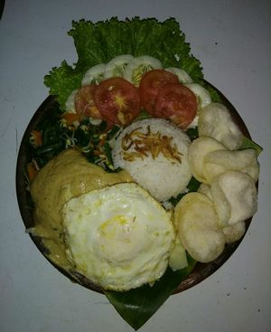 NASI PECEL mix boiled vegetble on peanut and citrus leaves  at LN Fortunate Coffee - Jogja in Yogyakarta