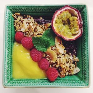 Acai bowl with home made granola, mango, raspberries and passionfruit. Yum! at Mahalo - Hornsgatan in Stockholm