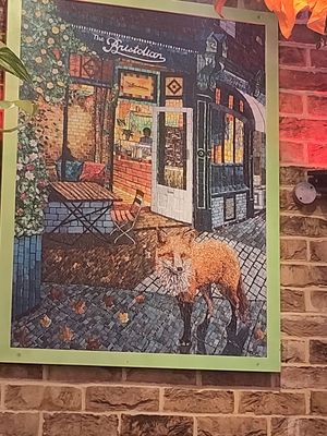 Picture of the cafe not sure who the artist is at The Bristolian in Bristol