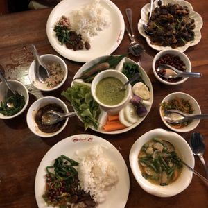 Mains: Thai Green Curry and Spicy Bean Curry - all the smaller bowls were free extras. Unlimited rice too. at Mingalabar Myanmar Restaurant in Mandalay