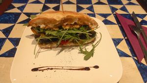 Grilled vegetable sandwich with hummus, arugula and chimichurry pesto at GustaV in Salzburg