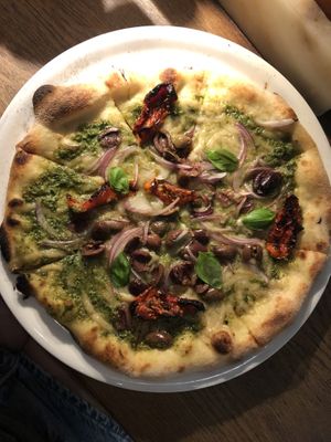 Pesto pizza with vegan cheese  at Vapiano in Sydney