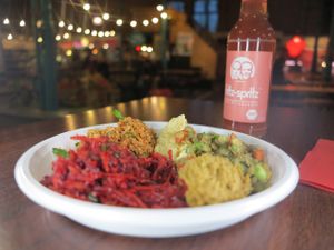 Sharing a mixed plate with dicious turkish vegan food at the vegan tour Berlin in Kreuzberg at Vegan Tours in Berlin