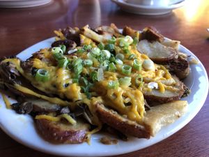 Veggie potatoes with Ciao cheese and field roast sausage  at Blue Star Cafe & Pub in Seattle