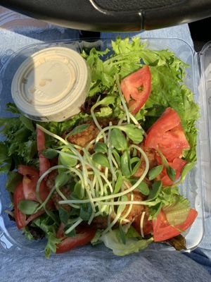 This is the sunshine burger on a salad with garlic tahini dressing. tiger lily never disappoints  at Tiger Lily Cafe in Port Jefferson