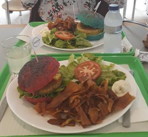 Two menus one with the smurf bun (blue spirulina) and the other with the beetroot bun! at Vegana Burgers - Atrium Saldanha in Lisbon