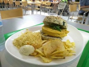 Chickpea and curry burger, chips, couscous, and mint mayo at Vegana Burgers - Atrium Saldanha in Lisbon