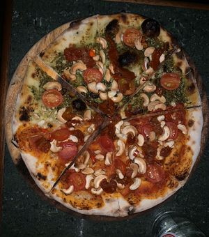 Pesto and spicy pizza at By Hand Cafe in Chiang Mai