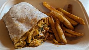 half of a Buff Burrito with some fries at Homegrown Smoker in Portland