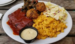 Seitan ribs, macnocheese, hushpuppies, coleslaw and collard greens 🤤 at Homegrown Smoker in Portland