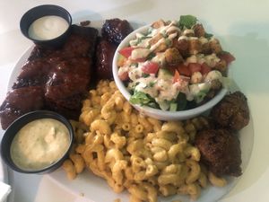 Share plate with Mac n cheeze, seitan ribs, salad and wings at Homegrown Smoker in Portland