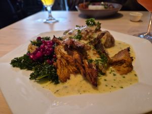 Seitan with vegan bernaise, hasselback potatoes, and kale and lingonberries salad at Blackbird in Gothenburg