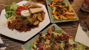 Cesar salad, cheesy fries, Kebab tellarik at Blackbird in Gothenburg