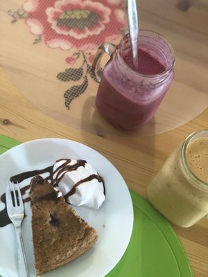 Smoothies and red berries cake. at Alcachofra Cafe in Faro
