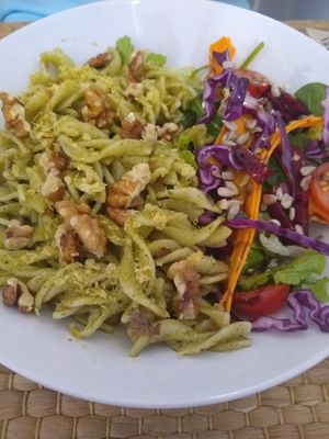 Pesto pasta with salad at Alcachofra Cafe in Faro