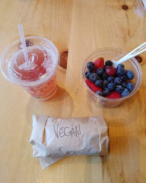 Vegan breakfast burrito!  Kombucha, and a fruit cup! 🙌   at Oryana Natural Foods Market in Traverse City