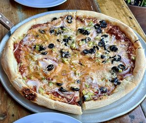 Build your own pizza at LFK with red sauce, vegan cheese, black olives, green peppers, and red onions. Excellent!  at LFK in Portland