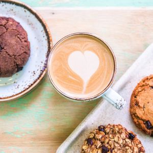 Almond coffee with vegan cookies at Kawa Kawa Bar in Omsk