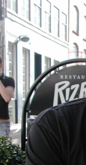 The terrasse nicely located on a pedestrian street with bicycles.  It is nice looking at Danish people going on with their busy daily life. at RizRaz - Kompagnistraede in Copenhagen