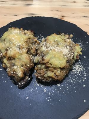 Stuffed aubergine with rice, vegetables, tomato paste, vegan cheese and nutritional yeast at A Factoria Verde in A Coruna
