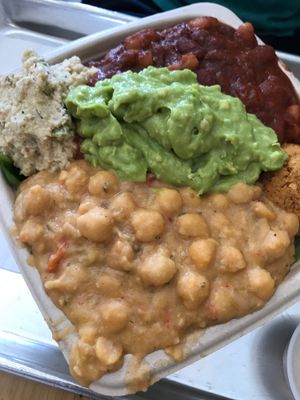 super hero sampler with tomato chickpea, avo mash, bean chili, falafel, veggie tuna on a bed of spinach and quinoa. soo big and filling!  at Plant Wise in Dix Hills
