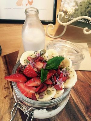 WYE's Cacoa and Goji Berry Granola served with mixed berries, coconut yoghurt and almond milk at Wild Thyme Cafe in Bright