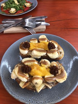 Banana three ways and sweet pot pizza in the background  at Wild Thyme Cafe in Bright