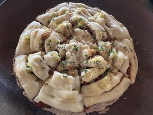 Cauliflower pizza - little flavor overwhelmed by the too soft buckwheat crust  at Moksa in Ubud