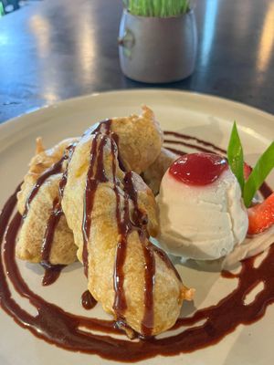 Pisang Goreng – Crispy golden banana fritters served warm with creamy ice cream and rich natural chocolate sauce. at Moksa in Ubud
