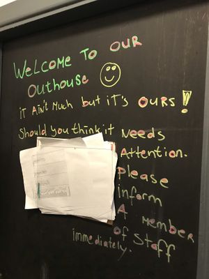 Sign in bathroom, which is outside down an alley at The Gourmet Offensive in Galway