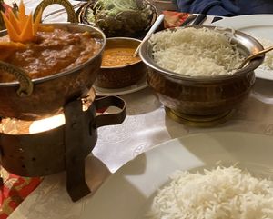 Yummy vegan cauliflower and potato stew served with rice (lamb and another sauce in the background). at Namaste Nepal in Chemnitz