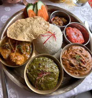 Thali (Kalo Dal, Mismas Tarkari, Tofu Palungo, Laalmohan)  at Namaste Nepal in Chemnitz