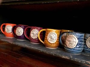 Hand-thrown mugs from MUD Ceramics at Lucky Johnson General Store in Wardensville