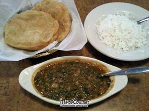 Masaledar Pav Bhaji (vegan)-steamed potatoes, peas, cauliflower, tomatoes, onions, and garlic cooked with tasty seasonings, garnished with cilantro. at Chowpatti in Arlington Heights