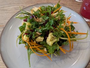 Langos with sour cream, marinated cauliflower, beets, carrots, zucchini and arugula at Pastva in Prague