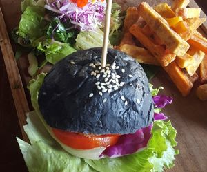 Burn out burger on a charcoal bun. A must try! at Pels Supershop in Tibubeneng