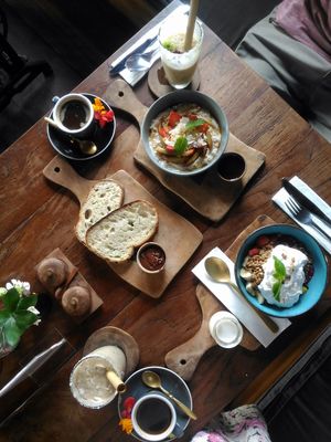 Porridge (top), granola (right), smoothies and sourdough toast with vegan nutella at Pels Supershop in Tibubeneng
