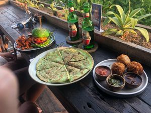 Burger, quesadilla and arinchini balls at Pels Supershop in Tibubeneng
