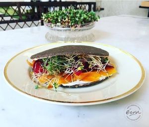 The perfect sandwich to make a perfect meal at any time of day! Mixed carpaccio, cashew lemon cream, arugula and radish sprouts. Everything with our raw bread (sprouted buckwheat, flax seeds, chia seeds and sunflower seeds).  at Ecru in Rome