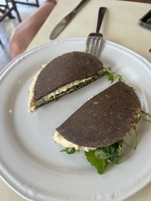 Hummus, arugula, sun dried tomatoes, and raw bread !!! Yum !!!!  at Ecru in Rome