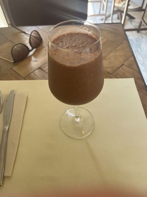 Tiramisu milkshake in a wine glass, super cute!  at Ecru in Rome