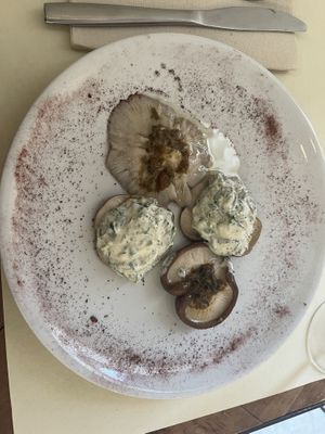 Stuffed mushrooms. The just seasoned ones were delicious, the filling in the other two was okay.  at Ecru in Rome
