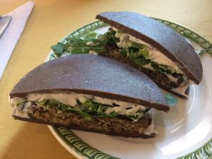 Sandwich with burger patty at Ecru in Rome