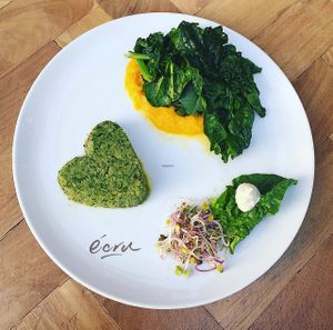 Sicilian broccoli and avocado pie, massaged with spinach on pumpkin cream. at Ecru in Rome