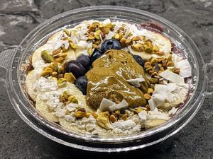 Acai, pistachio butter, banana and plant milk blended together, topped with blueberries, pistachio butter, coconut, banana and pistachio granola at Juice Generation - FiDi in New York City