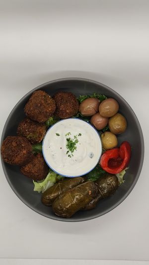 Falafel fritters, Dolmas, & craked olives.  at Nokturne in Houston