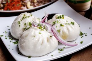 Steamed buns filled with seasonal greens. at Nokturne in Houston