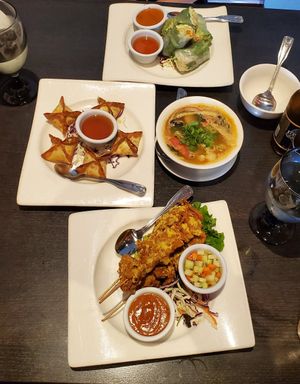 Cream cheese wontons, spring rolls, soup, soy chiken satay at Veganic Thai Cafe in San Diego