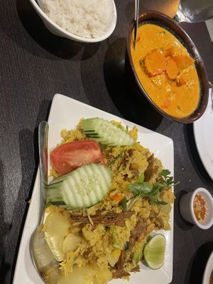 Pineapple fried rice with soy duck and Panang curry with soy chicken   at Veganic Thai Cafe in San Diego