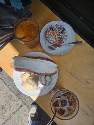The glacé, latte glacé, tarte à la prune, biscuits sablé à l’amande, biscuit au citron, petit sablé et truc délicieux à la crème et à l’orange. at Cafe Dei Campi in Montreal